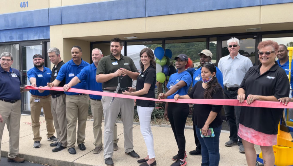 JAN-PRO Franchise costs and franchisees at a ribbon cutting for new location
